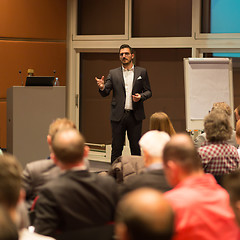 Image showing Business speaker giving a talk in conference hall.