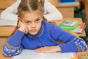 Image showing First grader to read the lesson and looking at teacher listens carefully to his