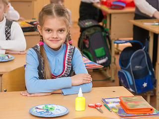 Image showing Happy first grader at a lesson in the school of technology, look in the frame