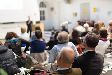 Image showing Woman giving presentation in lecture hall at university.