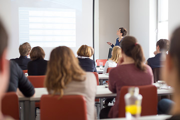 Image showing Woman giving presentation in lecture hall at university.