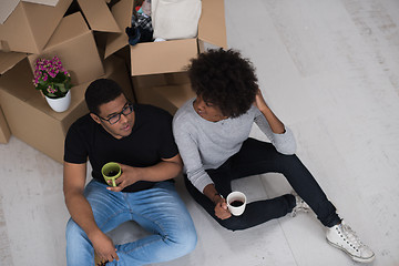 Image showing African American couple relaxing in new house