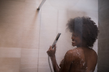 Image showing African American woman in the shower