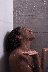 Image showing African American woman in the shower