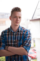 Image showing man standing at balcony