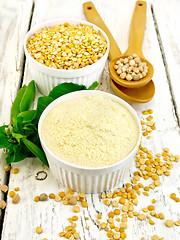 Image showing Flour pea and split pease in bowls and spoons on light board