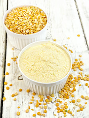 Image showing Flour pea and split pease in white bowls on board