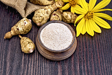 Image showing Flour of Jerusalem artichoke in clay bowl on board