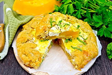 Image showing Pie of pumpkin and cheese with parsley on board