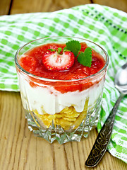 Image showing Dessert milk with strawberry in glassful on wooden board