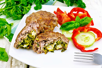 Image showing Cutlets stuffed with vegetables in plate on board