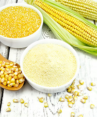 Image showing Flour and grits corn in bowls with grains on board