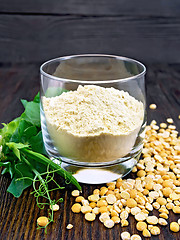 Image showing Flour pea in glassful on dark board