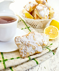 Image showing Cookies lemon with tea on board