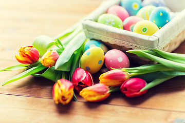 Image showing close up of colored easter eggs and flowers