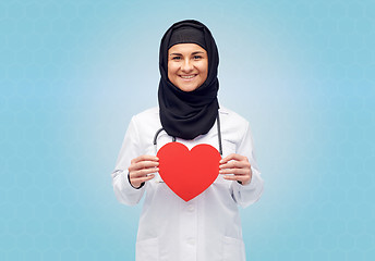 Image showing muslim female doctor in hijab holding red heart