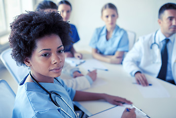 Image showing female doctor over group of medics at hospital