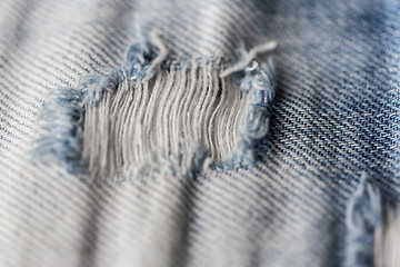 Image showing close up of hole on shabby denim or jeans clothes