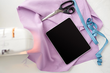 Image showing sewing machine, tablet pc, scissors and ruler