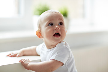 Image showing happy little baby boy or girl at home