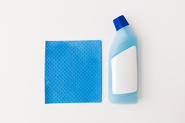 Image showing bottle of detergent and blue rag on white