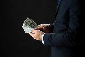 Image showing close up of businessman hands holding money