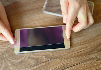 Image showing Installing safety glass on smartphone