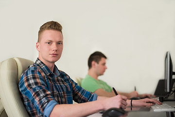 Image showing a group of graphic designers at work