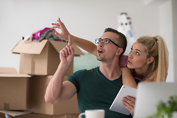 Image showing Young couple moving in a new home