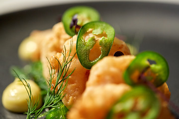 Image showing close up of king prawns with jalapeno