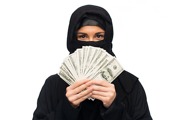 Image showing muslim woman in hijab with money over white