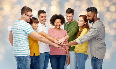 Image showing international group of happy people holding hands