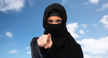 Image showing muslim woman in hijab pointing finger to you