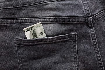 Image showing dollar money in pocket of denim pants or jeans