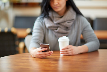 Image showing close up of woman with smartphone and coffee