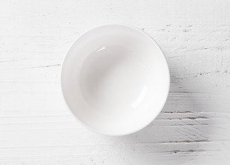 Image showing empty bowl on white wooden table
