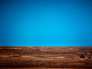 Image showing wooden board and blue background