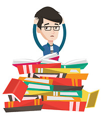 Image showing Student sitting in huge pile of books.