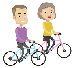 Image showing Happy senior couple riding on bicycles.