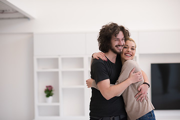 Image showing couple hugging in their new home