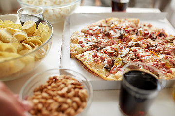 Image showing pizza and other fast food snacks on table