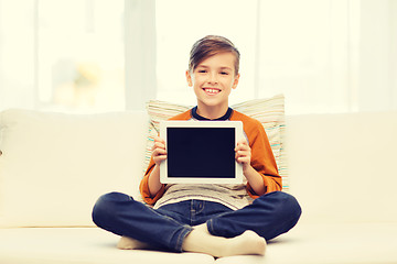 Image showing smiling boy with tablet computer at home