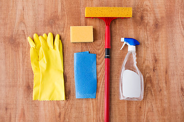 Image showing swab with cleaning stuff on wooden background