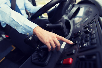 Image showing close up of driver driving passenger bus