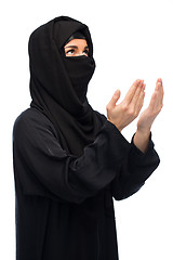 Image showing praying muslim woman in hijab over white