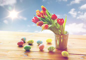 Image showing close up of easter eggs and flowers in bucket