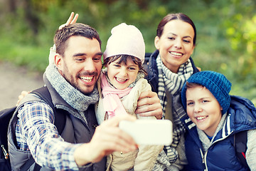 Image showing family taking selfie with smartphone in woods