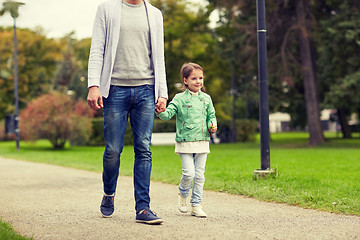 Image showing happy family walking in summer park