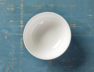 Image showing white bowl on blue wooden table