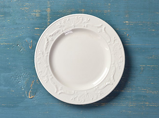 Image showing white plate on blue wooden table